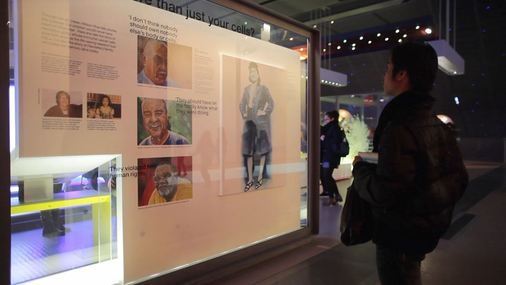 Wall panel with painted portraits of Henrietta Lacks's sons Lawrence, Sonny and Zakariyya, alongside a full-length painted portrait of Henrietta Lacks