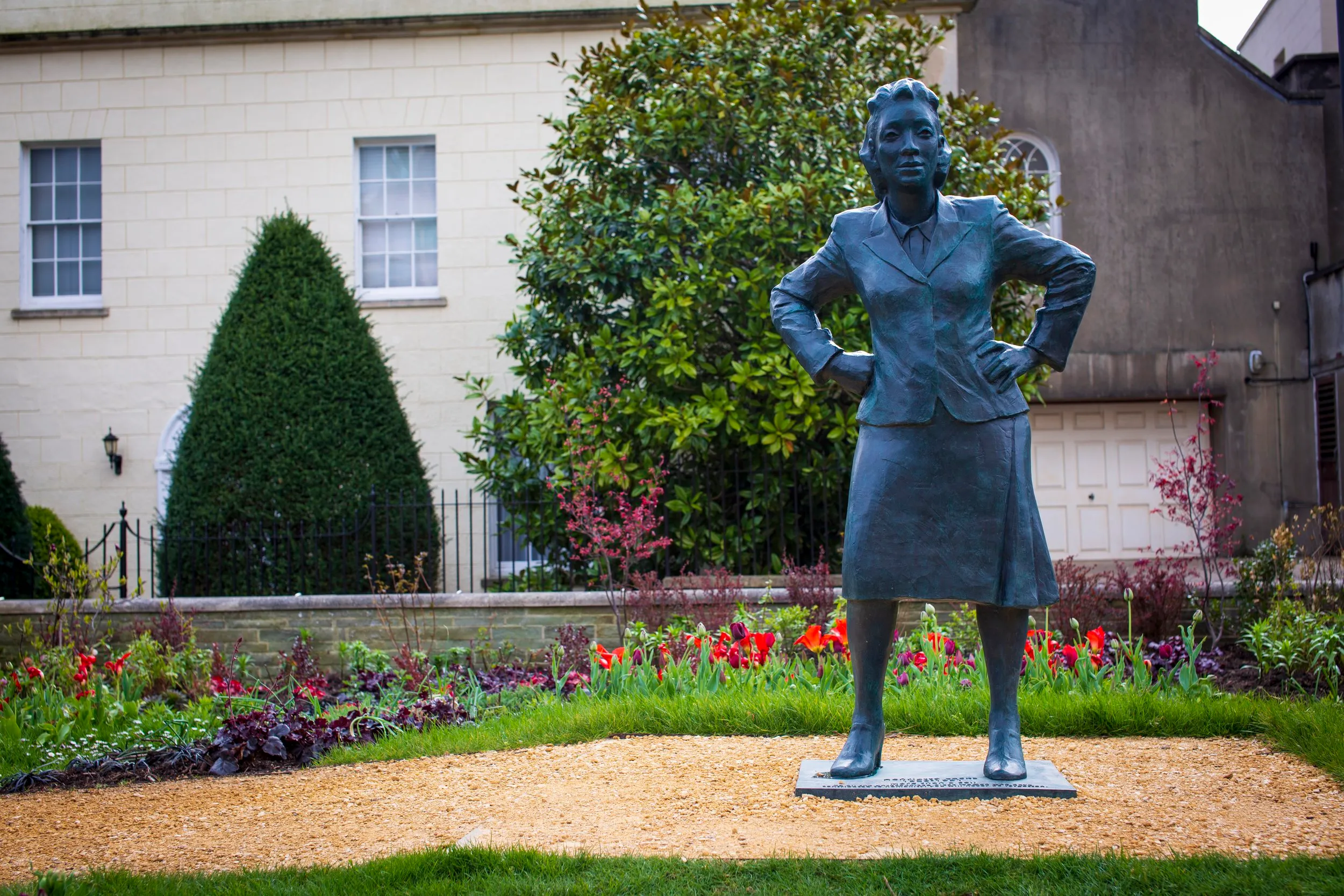 Bronze statue of Henrietta Lacks by Helen Wilson Roe, standing in a garden at the University of Bristol
