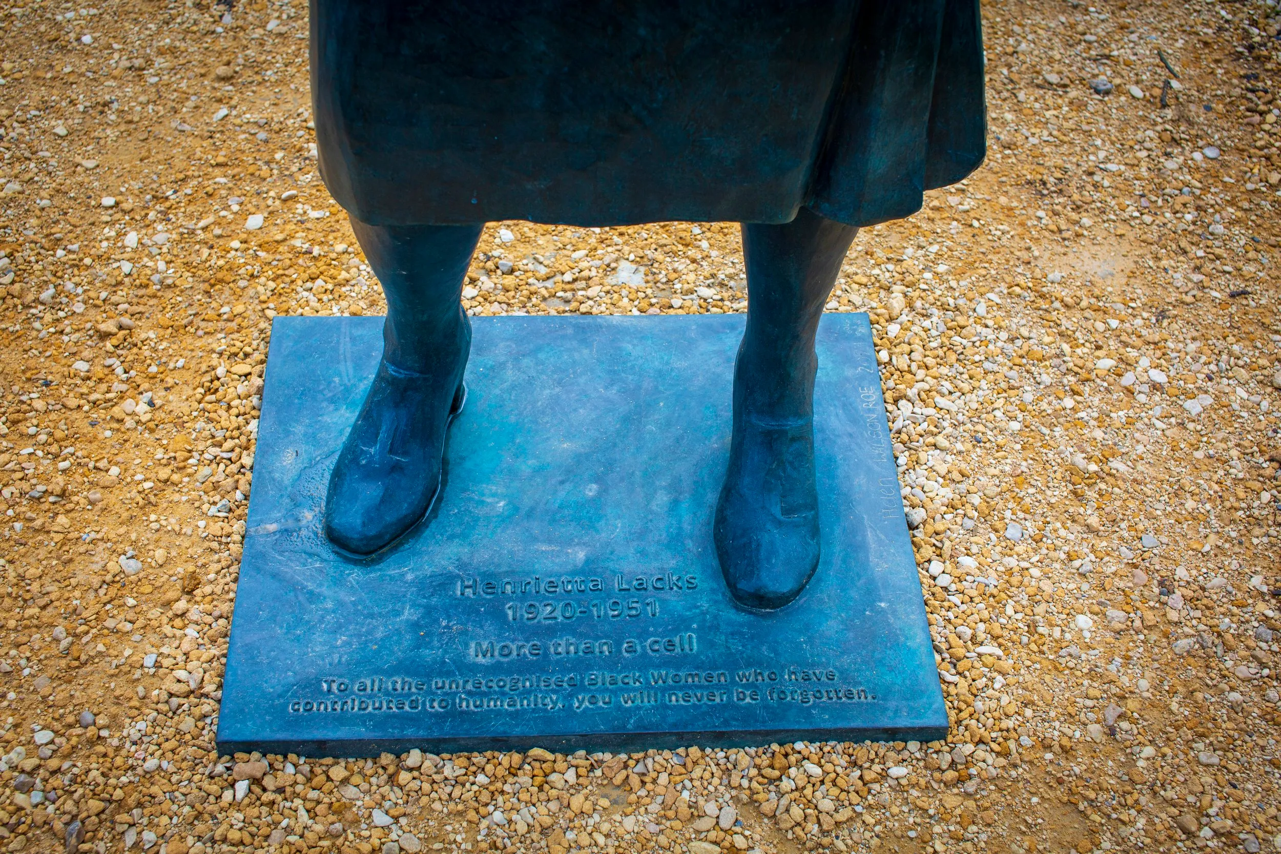 The statue's plinth, inscribed 'Henrietta Lacks 1920-1951, More than a cell, To all the unrecognised Black Women who have contributed to humanity, you will never be forgotten'